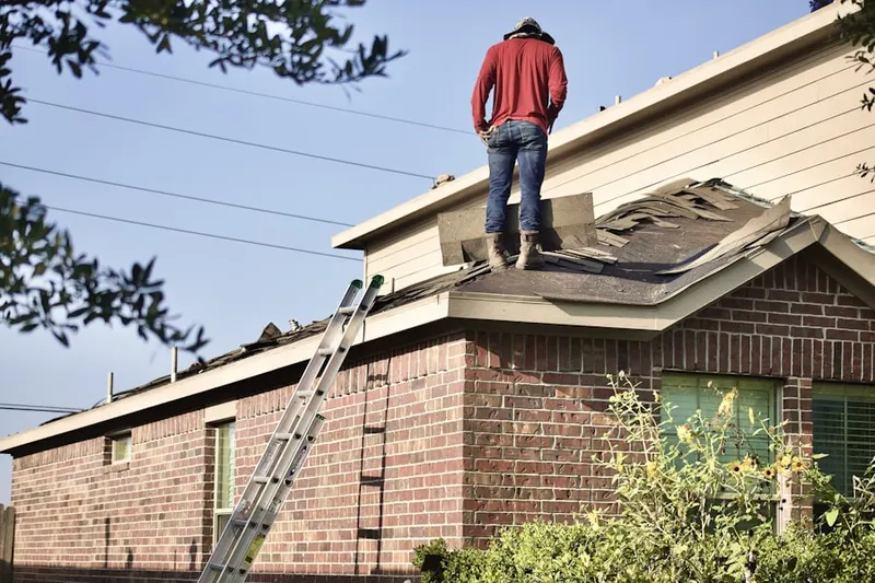 Professional roofer working on a residential roof in Brittany Estates